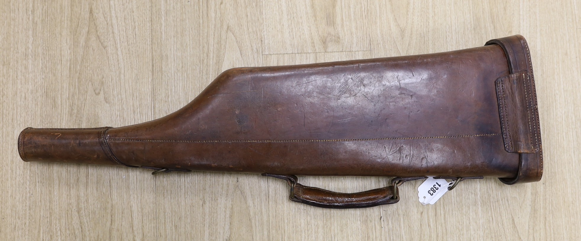 A brown leather gun case, 79cm wide